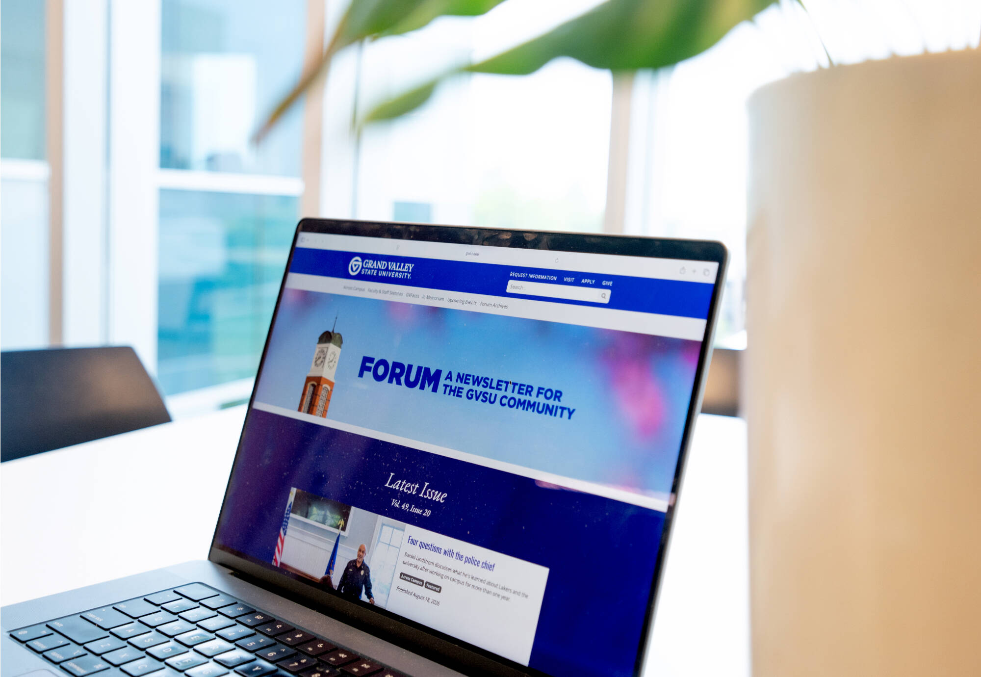 screenshot of Forum website on laptop